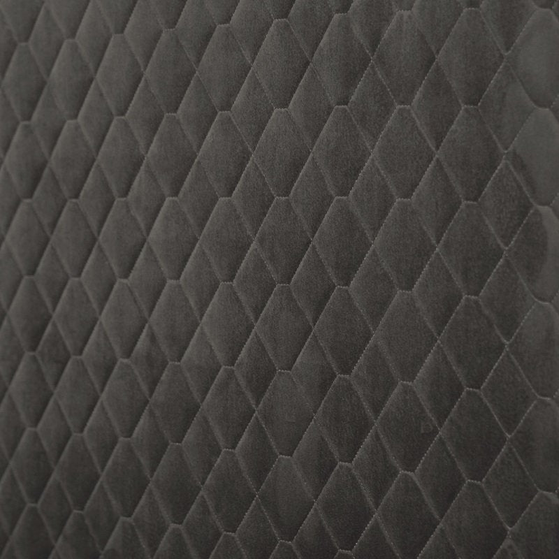 Close-up of dark gray quilted fabric with a diamond pattern