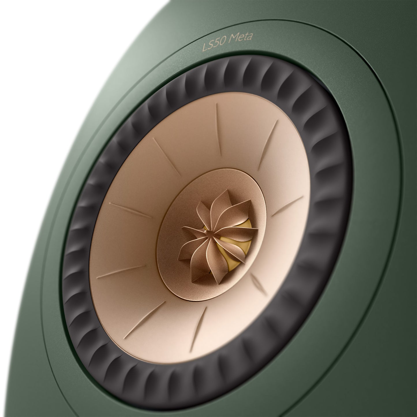 Close-up of a green speaker with beige center and 'LS50 Meta' branding.