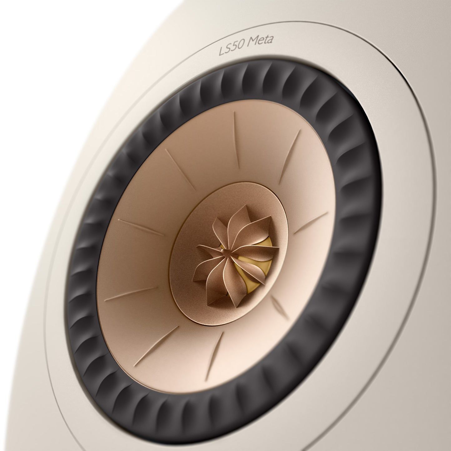 Close-up of a KEF LS50 Meta speaker driver on a light gray background