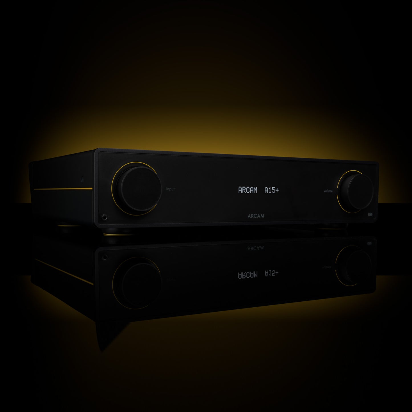 Black audio amplifier with digital display on a dark background