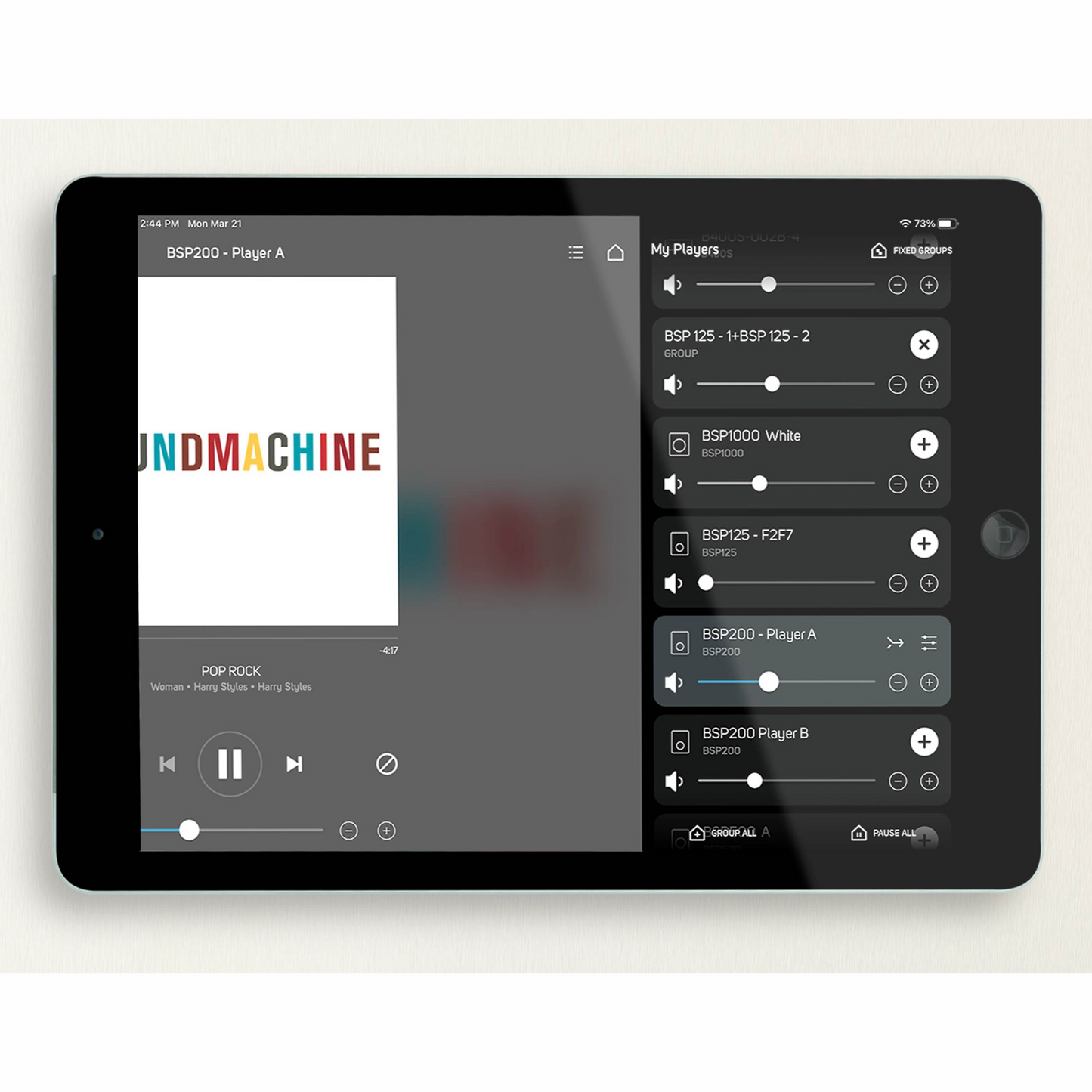 Tablet displaying a music player app with 'SOUND MACHINE' album cover on a white background