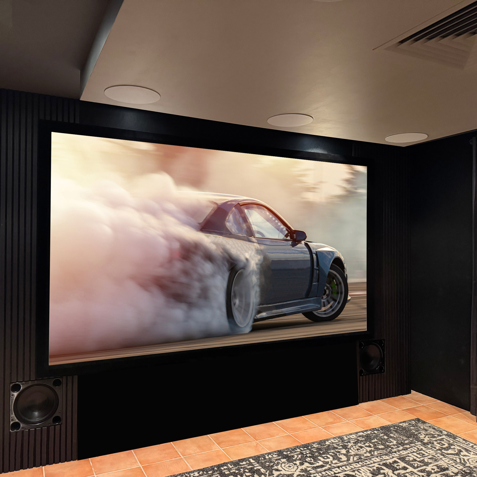 Room 4 at Audio Trends showroom movie playing on screen. Tuscan tiles and a black rug