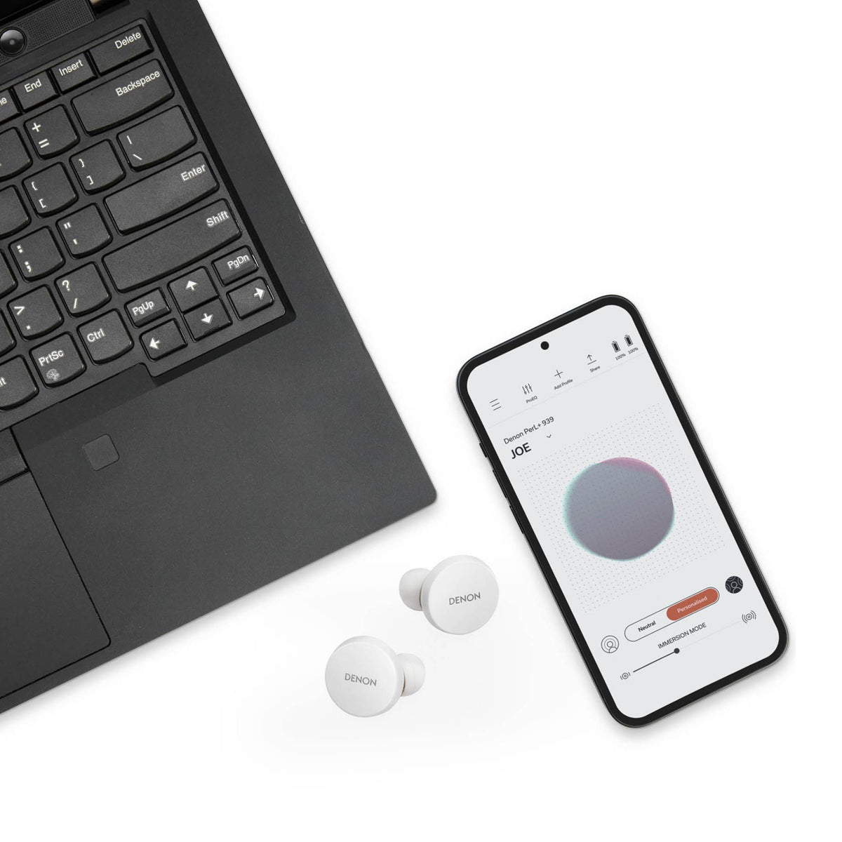 White Denon PerL Wireless Noise Cancelling Earbuds next to devices that can control them. App showing on phone