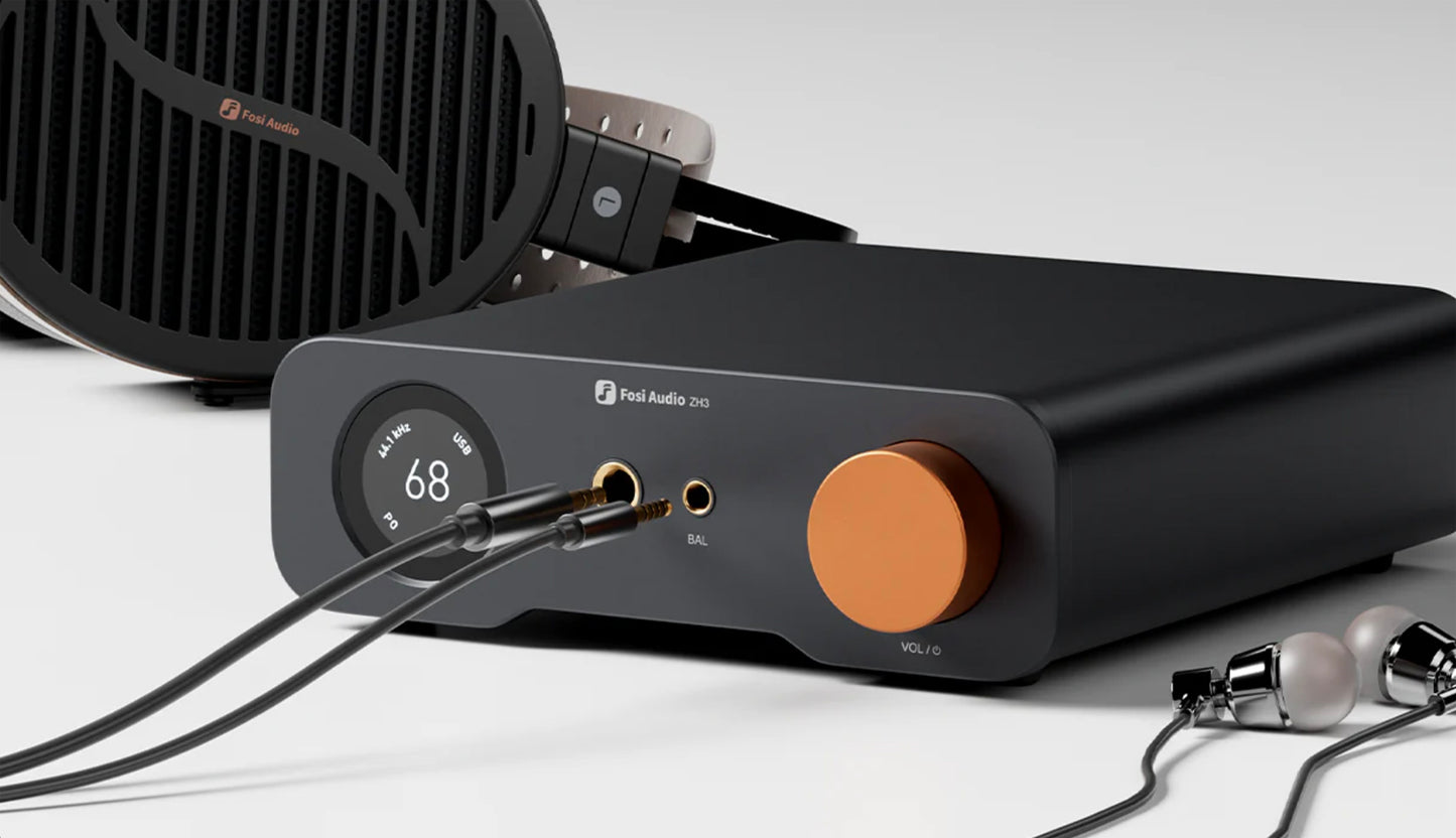 Fosi Audio ZH3 Headphone Amp DAC Preamp with headphones in background