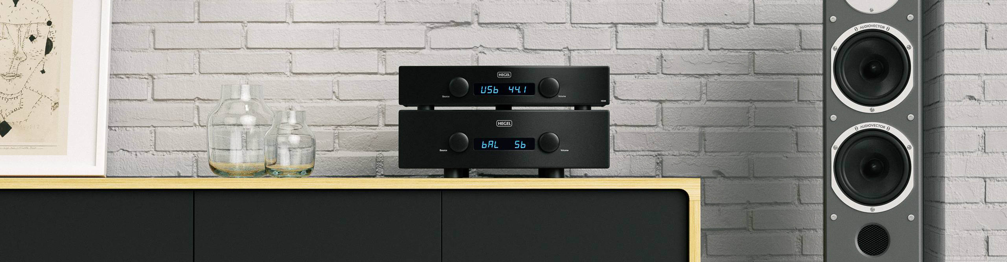 Hegel Components on cabinet with glass jars and speaker next to it
