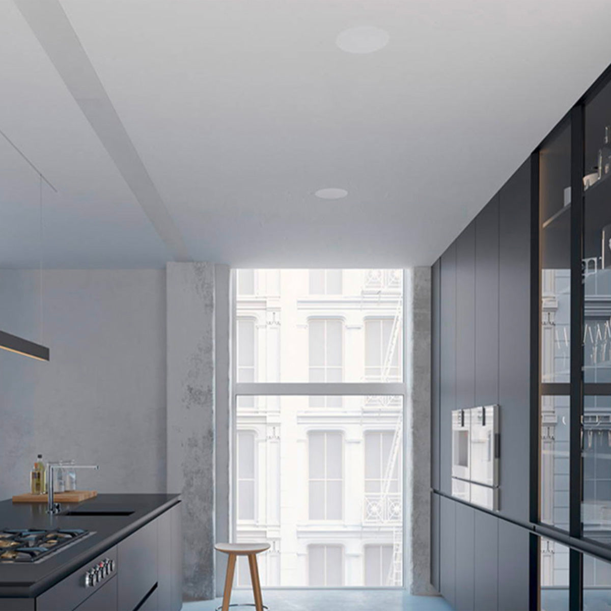 Modern kitchen with gray cabinets and a large window