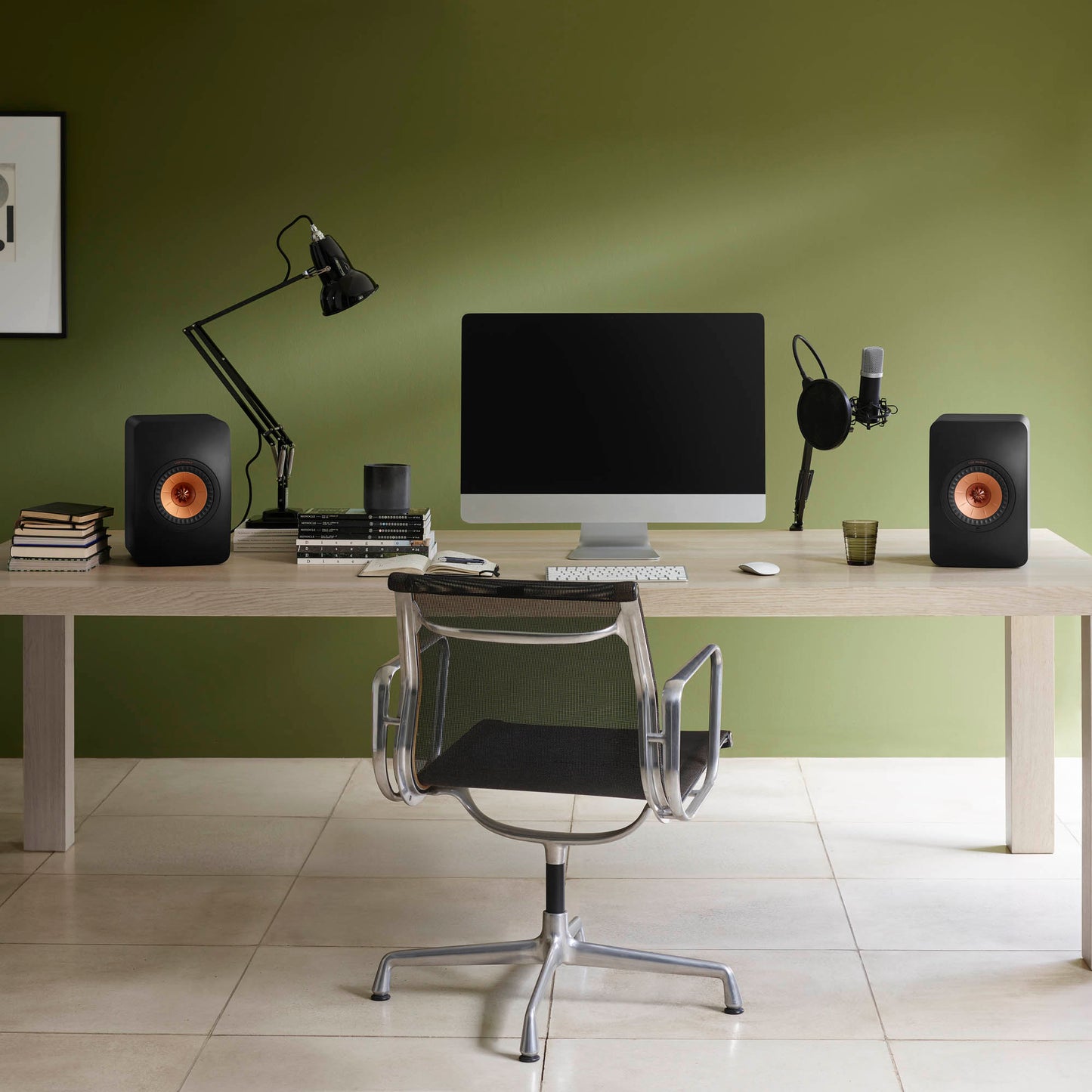 KEF LS50 Meta Bookshelf Speakers in Black finish on computer desk