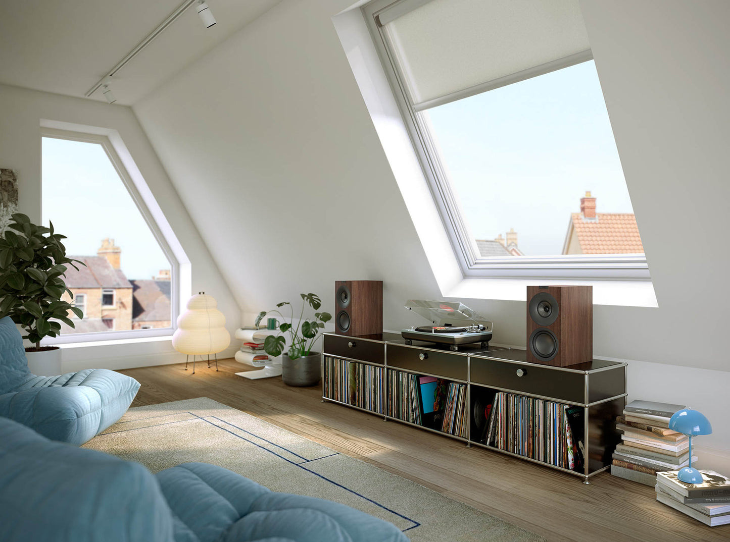 KEF Q Concerto Meta bookshelf speakers in walnut on cabinet next to turntable