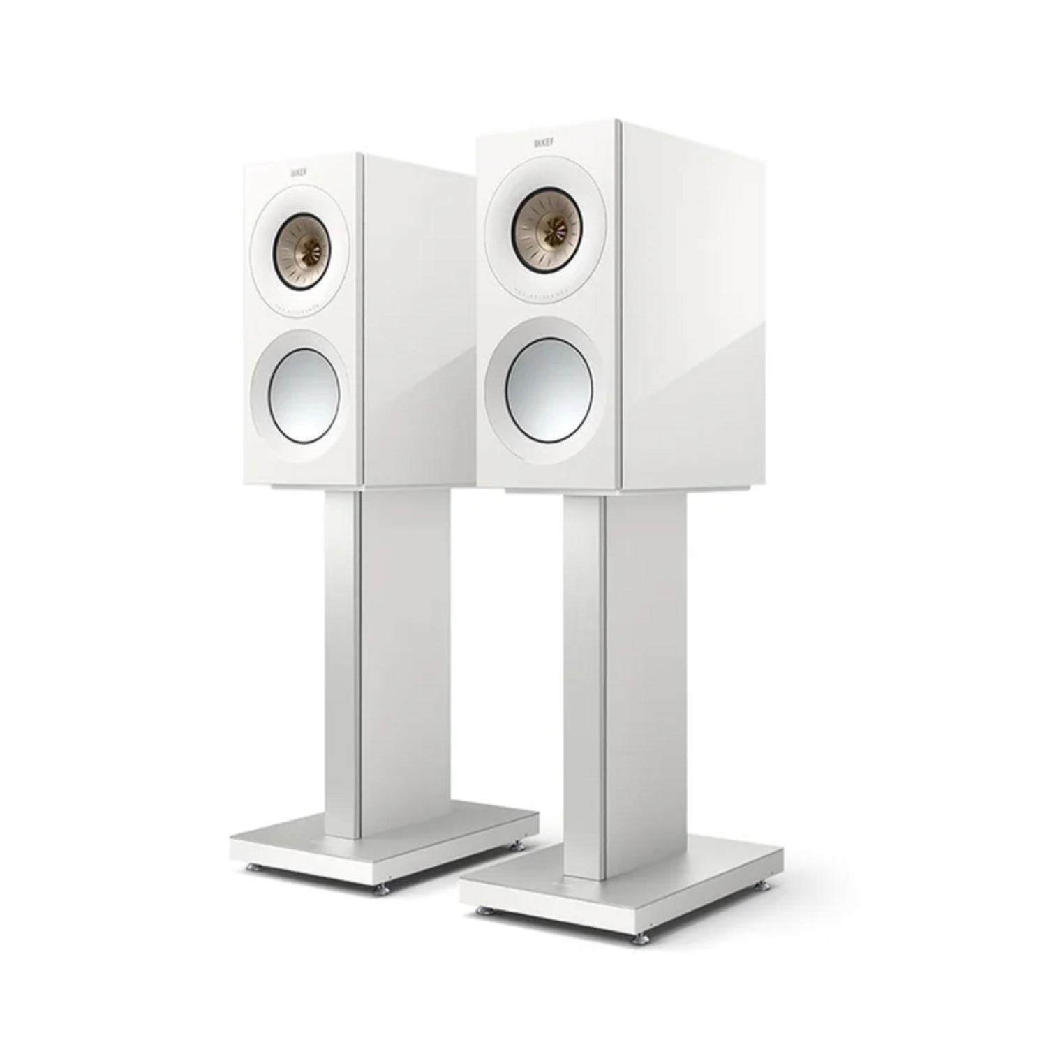 Pair of white KEF Reference 1 speakers on stands against a white background