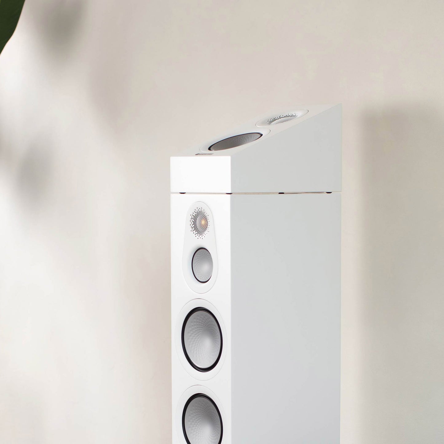 Monitor Audio Silver AMS 7G in white on top of floorstanding speaker