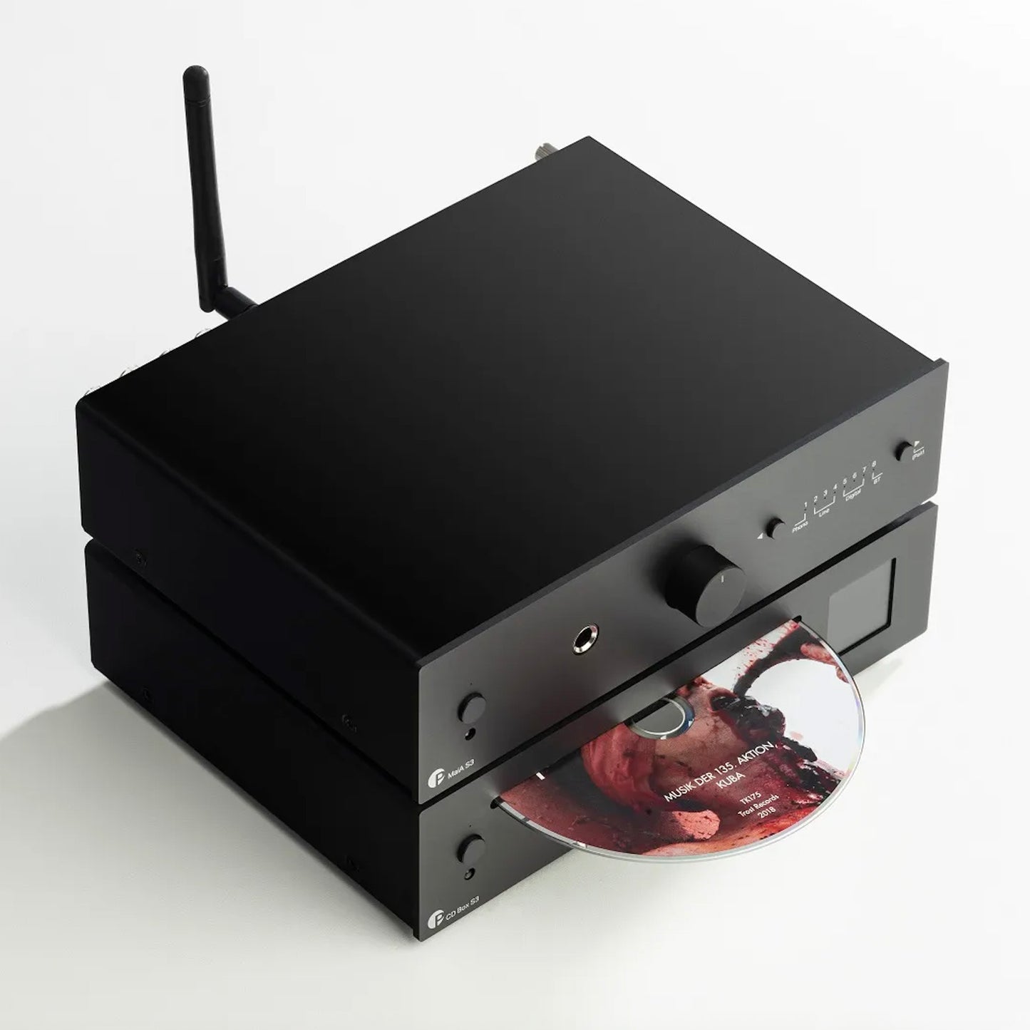 Black audio equipment with a CD on a white background