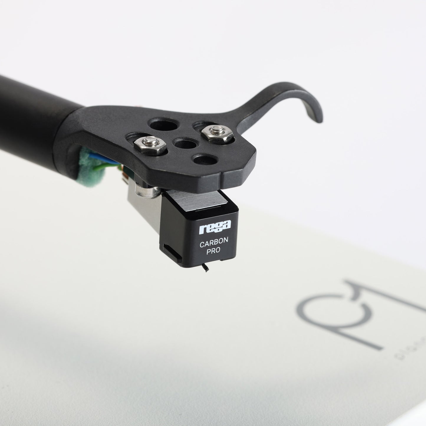 Rega carbon pro phonograph cartridge on a white background