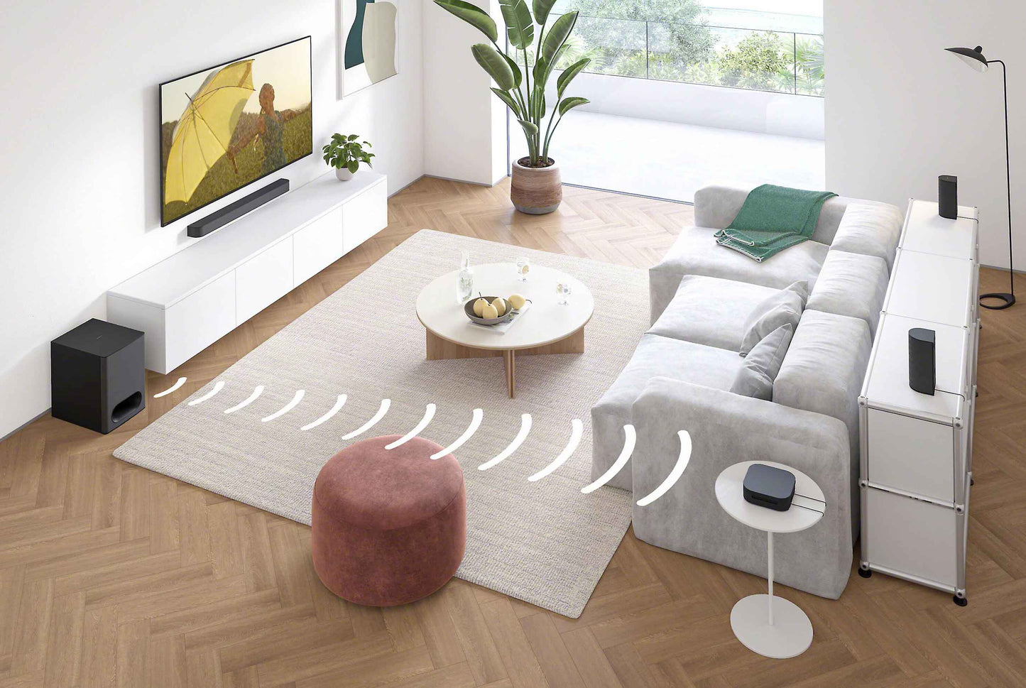 Living room with a TV, sofa, and soundbar setup.