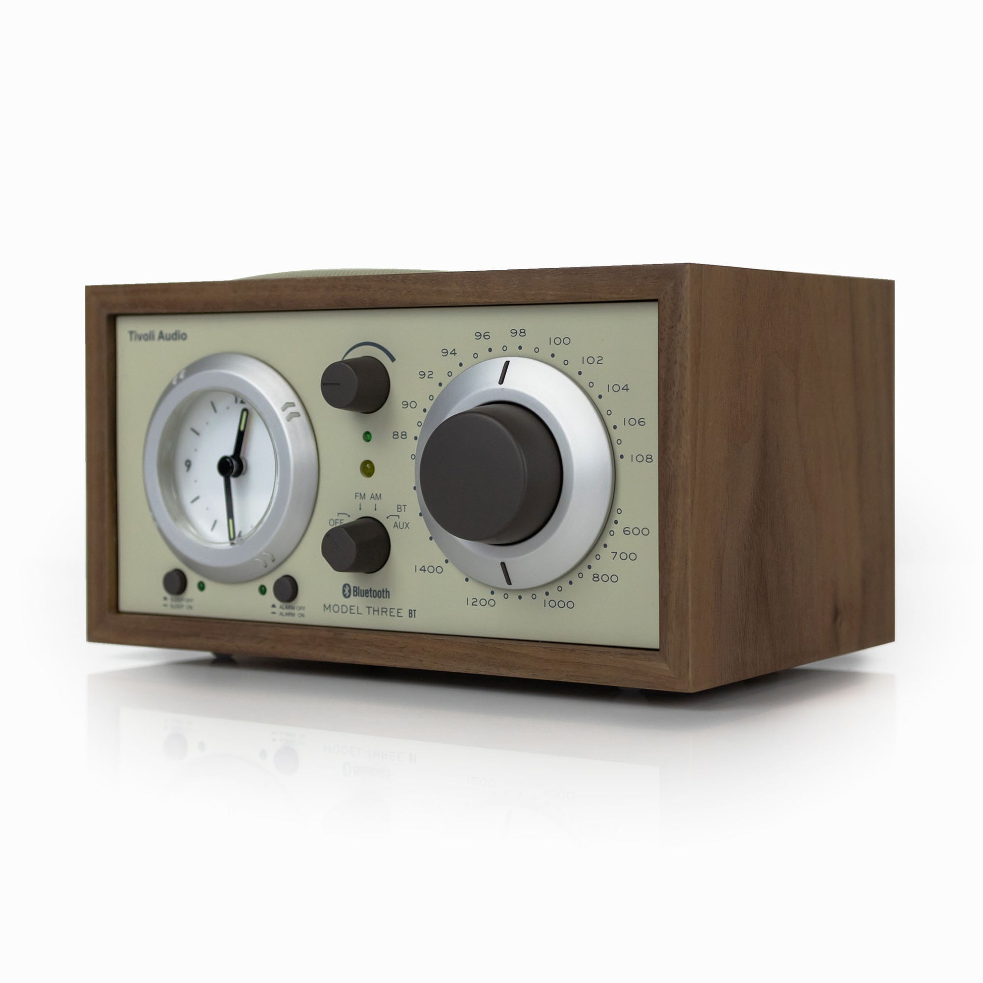 Wooden radio with analog dials on a white background