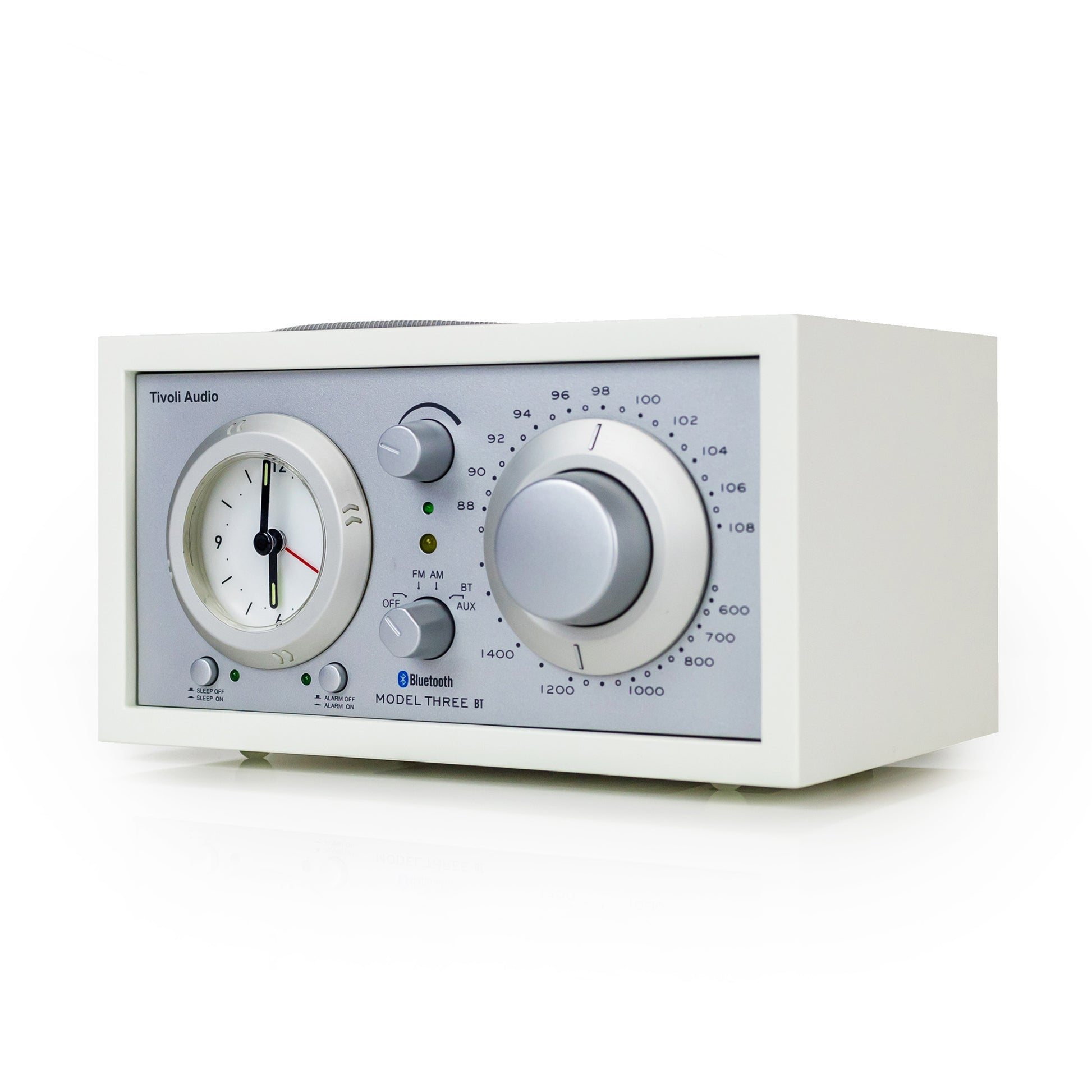 White audio device with clock and control knobs on a white background