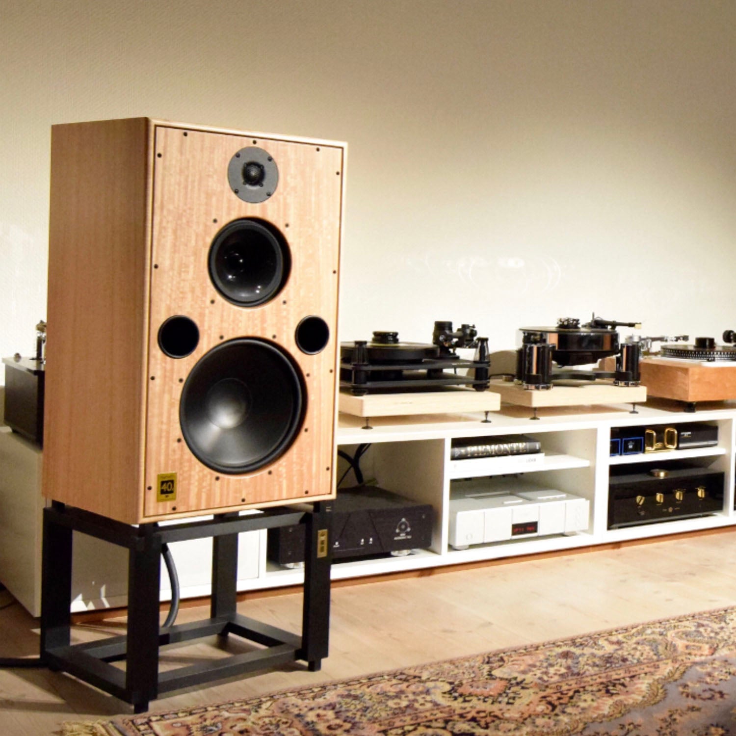 Harbeth Speaker on stand with HiFi in background