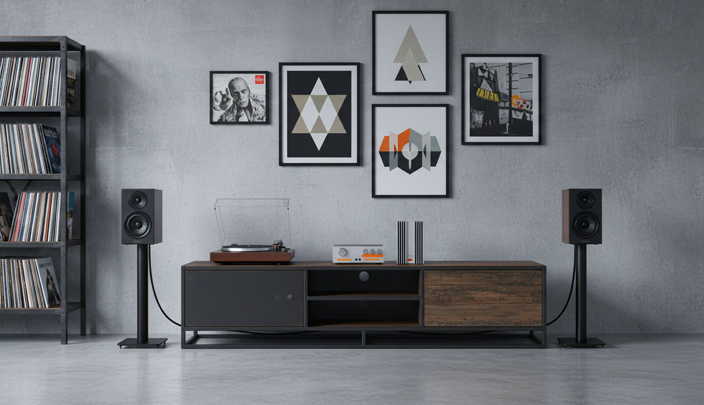 Modern living room with a television stand, speakers, and wall art.