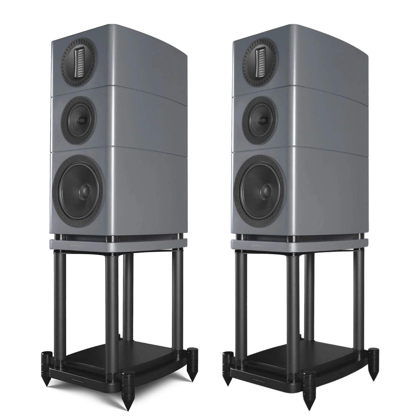 Two grey bookshelf speakers on black metal stands, shown side by side against a plain white background.