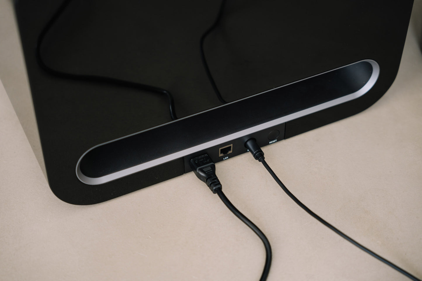 Black WiiM Sub Pro Subwoofer with cables attached