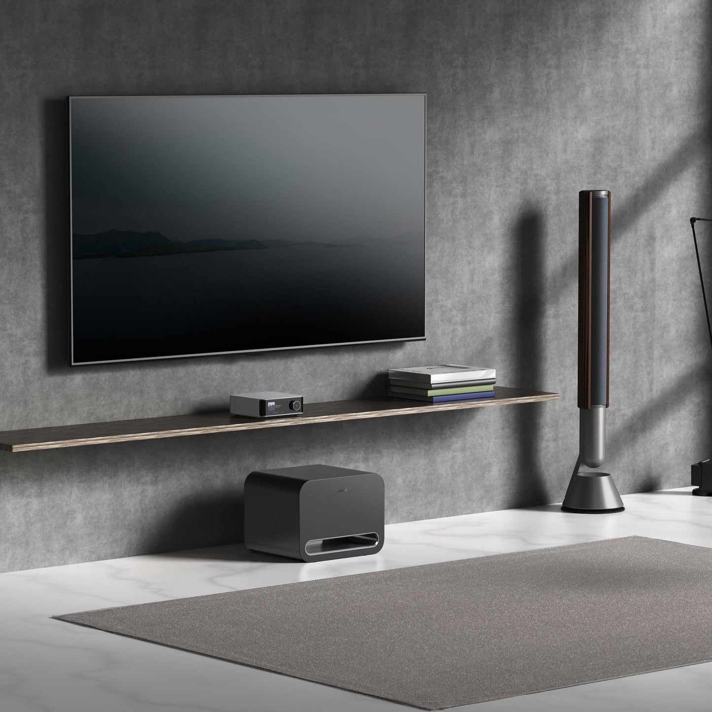 Modern home entertainment system with TV, speakers, and subwoofer against a gray wall.