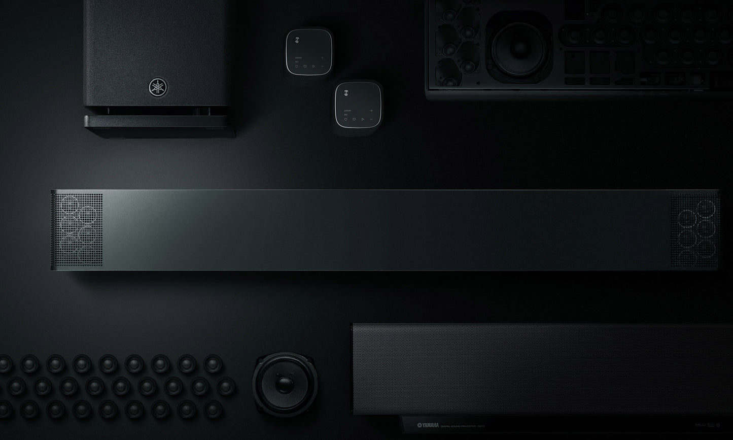 Black electronic devices arranged on a dark surface