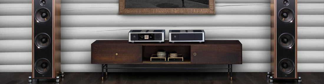 walnut hifi cabinet with 2 NAD products on top and floorstanding speakers at each side