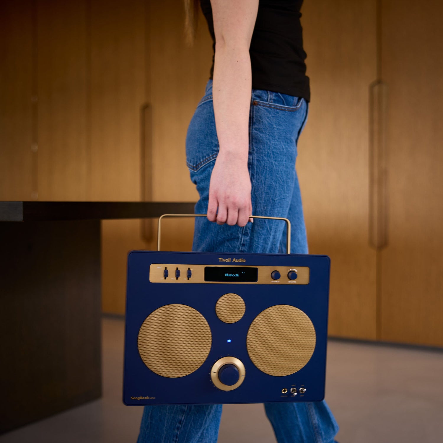 lady carrying portable speaker