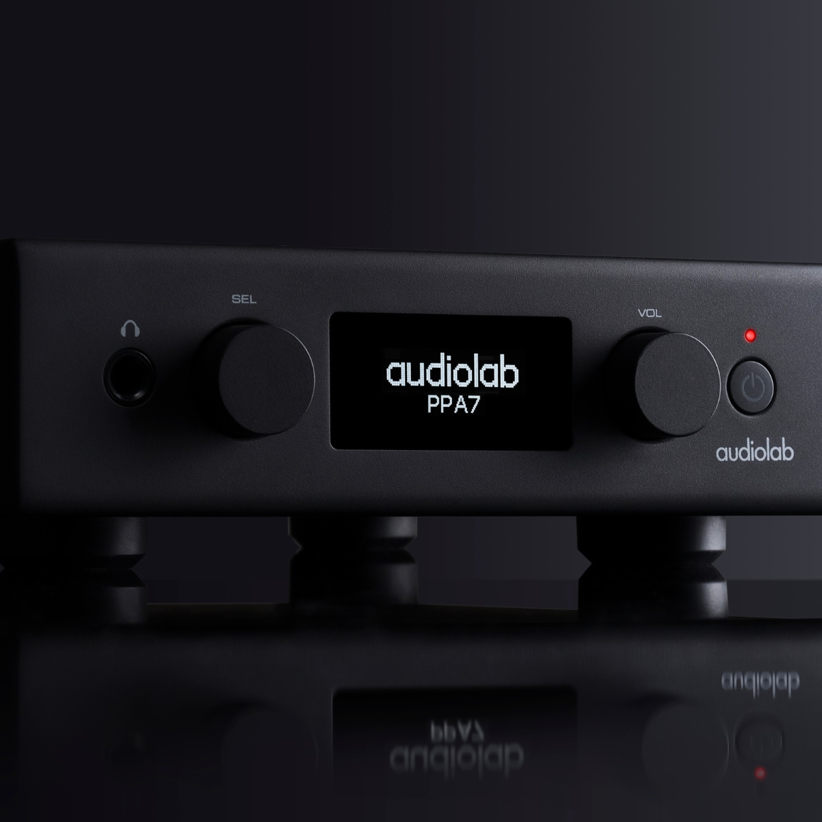 Close up of black Audiolab PPA7 Phono Preamplifier on black background