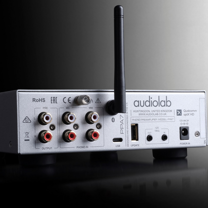 Back panel of silver Audiolab PPA7 Phono Preamplifier on gradient background