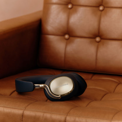 Blue headphones on tan couch