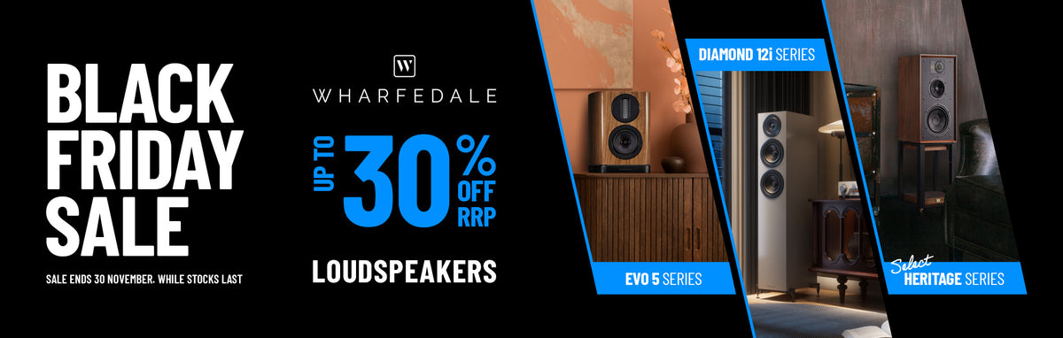 A promotional banner for Wharfedale featuring white and blue text reading 'BLACK FRIDAY SALE' and 'UP TO 30% OFF RRP LOUDSPEAKERS,' alongside three interior product photos on the right showing different speaker models in home settings.
