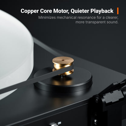 Close-up of a turntable with a copper core motor on a dark background