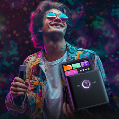 A smiling man wearing colorful sunglasses and a patterned jacket holds a black electronic device with a built-in screen and a separate slim controller.