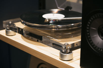 Turntable with a record on a wooden turntable stand
