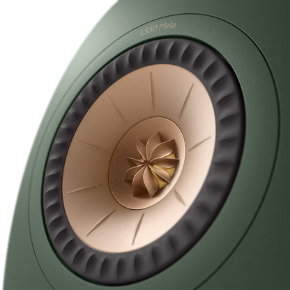 Close-up of a green speaker with beige center and 'LS50 Meta' branding.