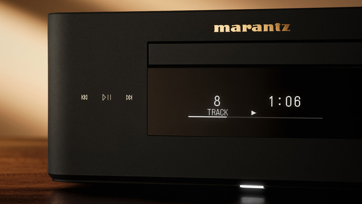 A close-up of a Marantz audio receiver or amplifier, showing the front panel with a digital display
