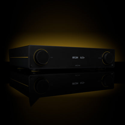 Black audio amplifier with digital display on a dark background