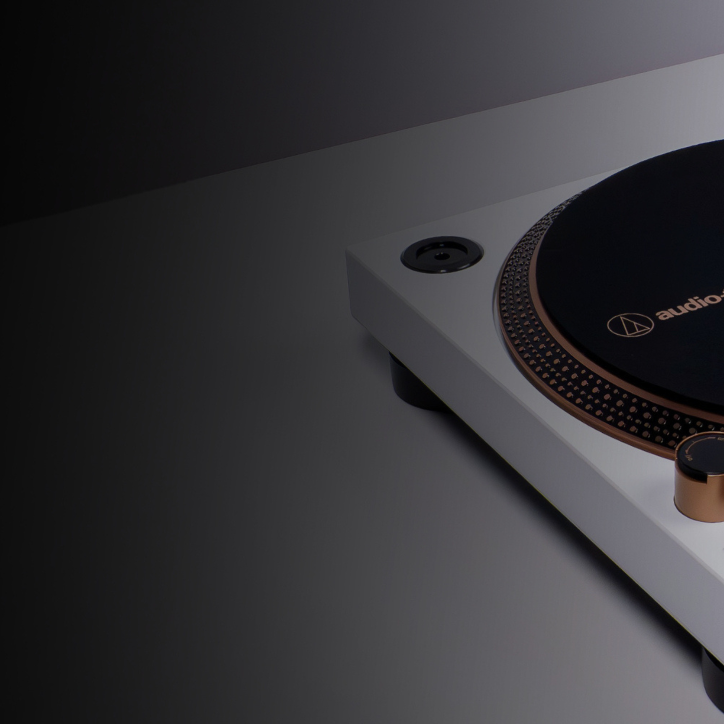 Turntable with Audio-Technica logo on a dark background