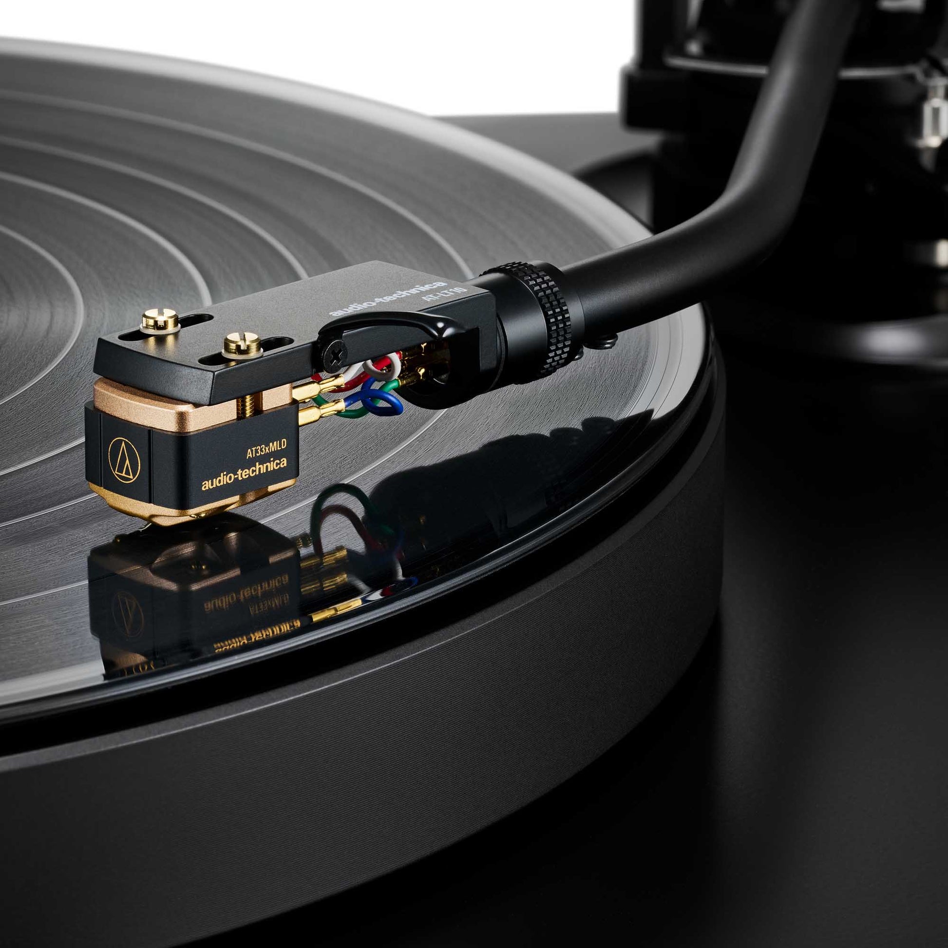 Close-up of a Audio Technica AT33xMLD Dual Moving Coil Stereo Cartridge on a turntable