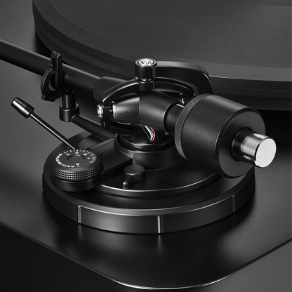 Close-up of a black turntable cartridge on a dark background