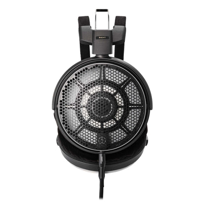 Black headphones with honeycomb design on a white background