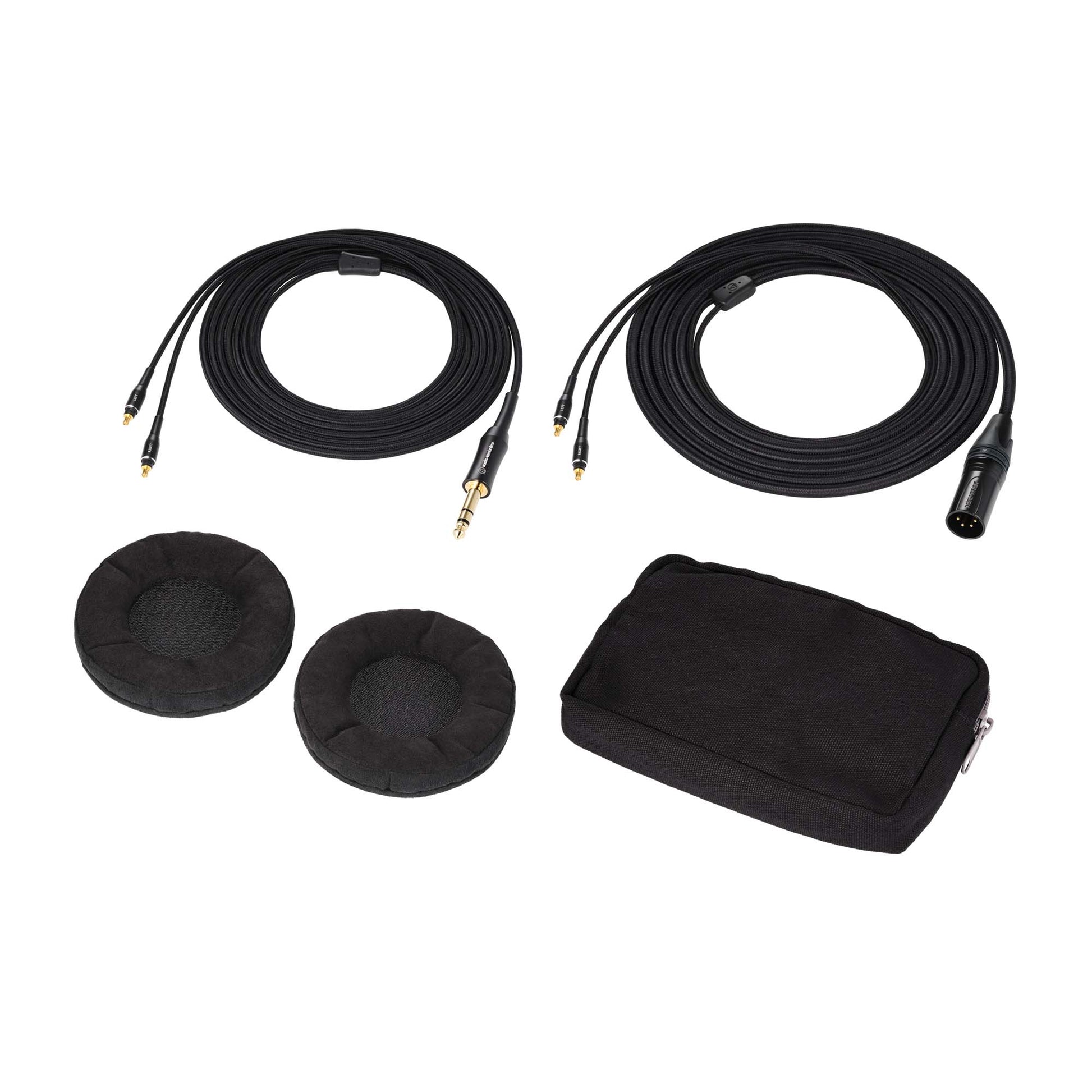 Set of black earbud covers, cables, and a carrying case on a white background