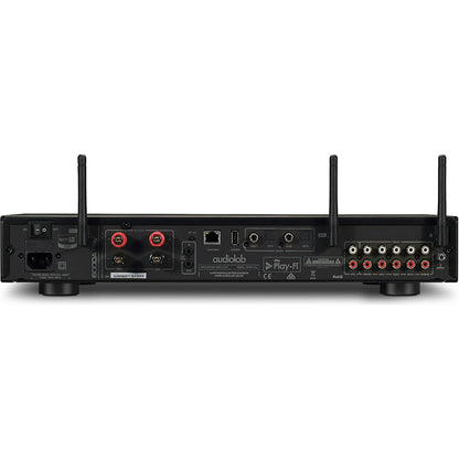 Back view of an Audiolab 6000A Play Stereo Amplifier with various connectors on a white background