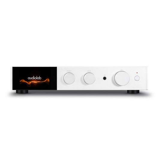 A white Audiolab 9000A Stereo Amplifier with control knobs and a digital display on the front panel set against a white background.