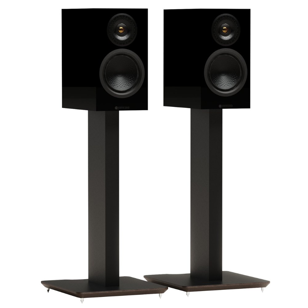 A pair of black bookshelf speakers with dual drivers, mounted on matching black floor stands.