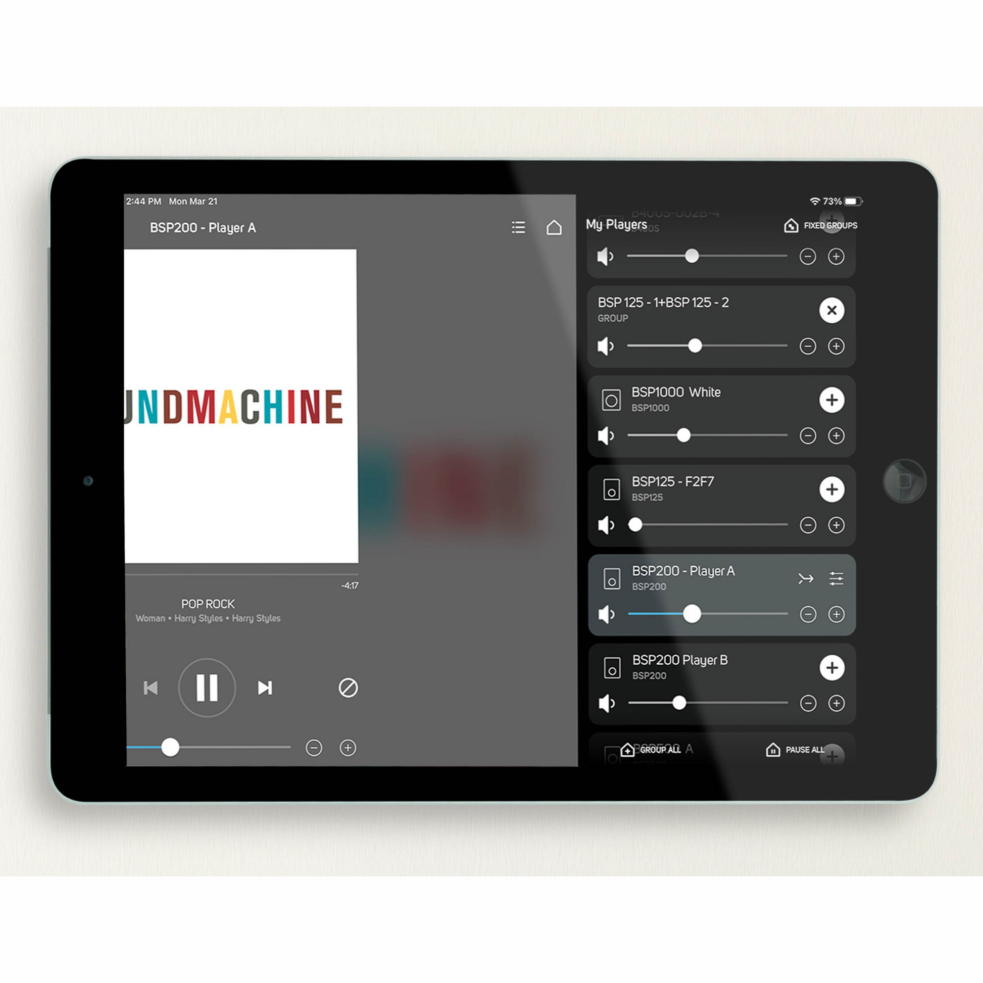 Tablet displaying a music player app with 'SOUND MACHINE' album cover on a white background