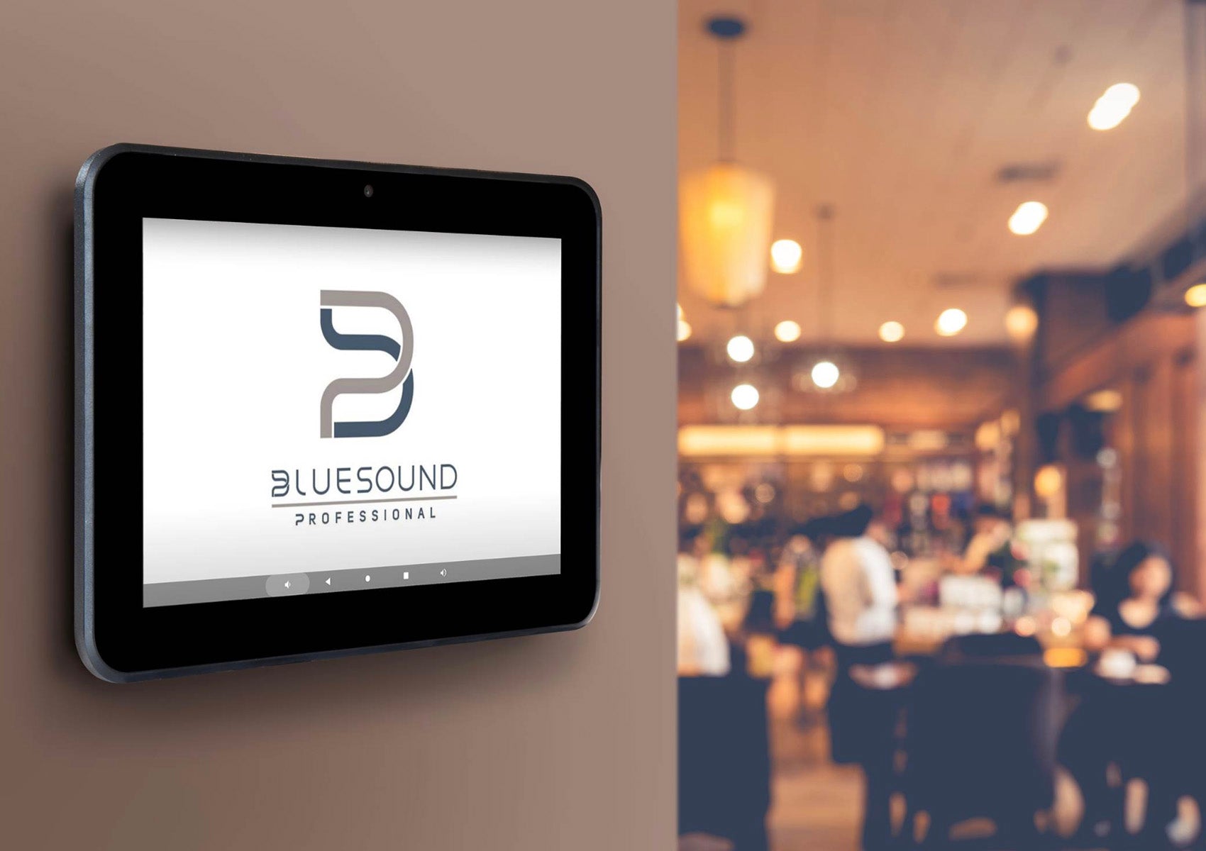 Digital display with Bluesound Professional logo in a restaurant setting