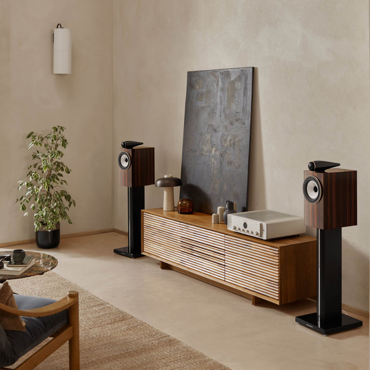Bowers & Wilkins in living room with art and plant