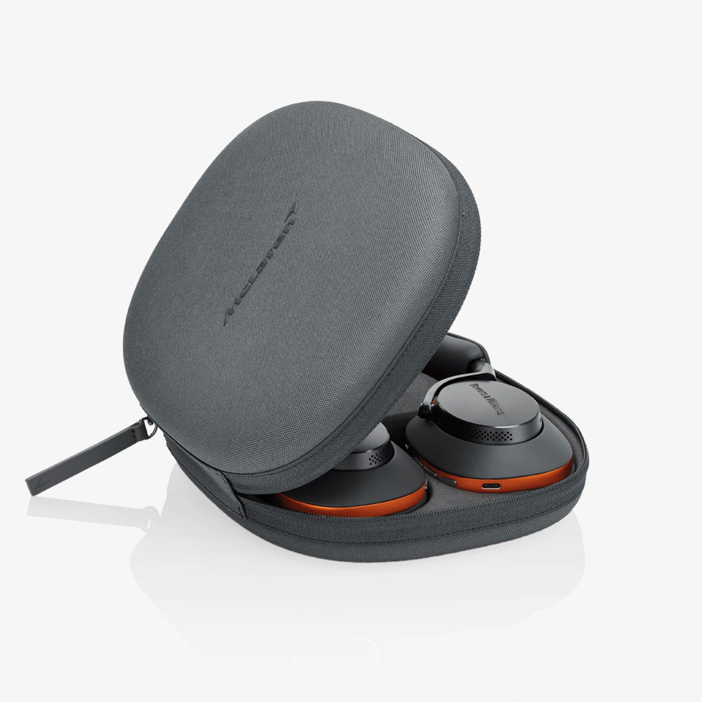 Gray carrying case with headphones inside on a white background