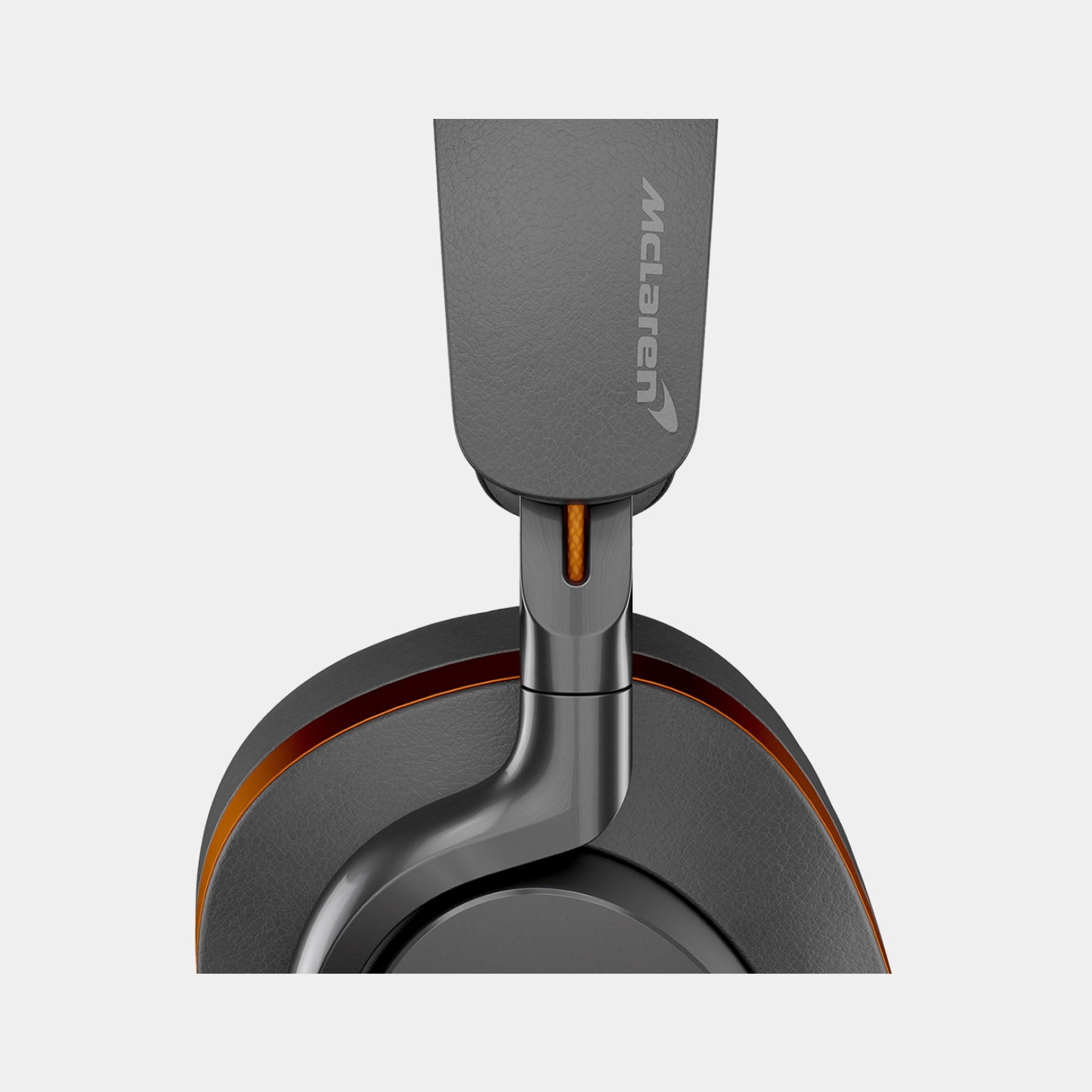 Gray McLaren headrest with brand logo on a light gray background